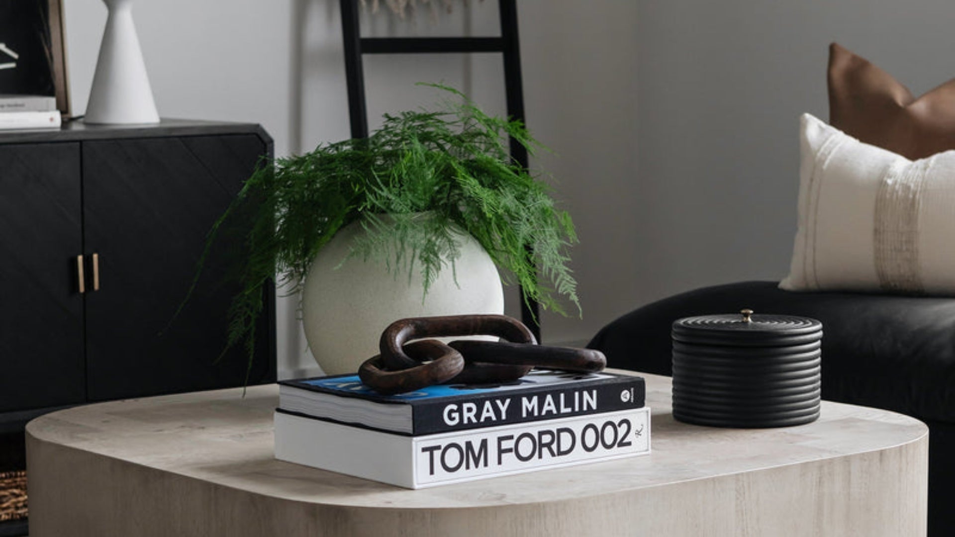 Two coffee table books on a table